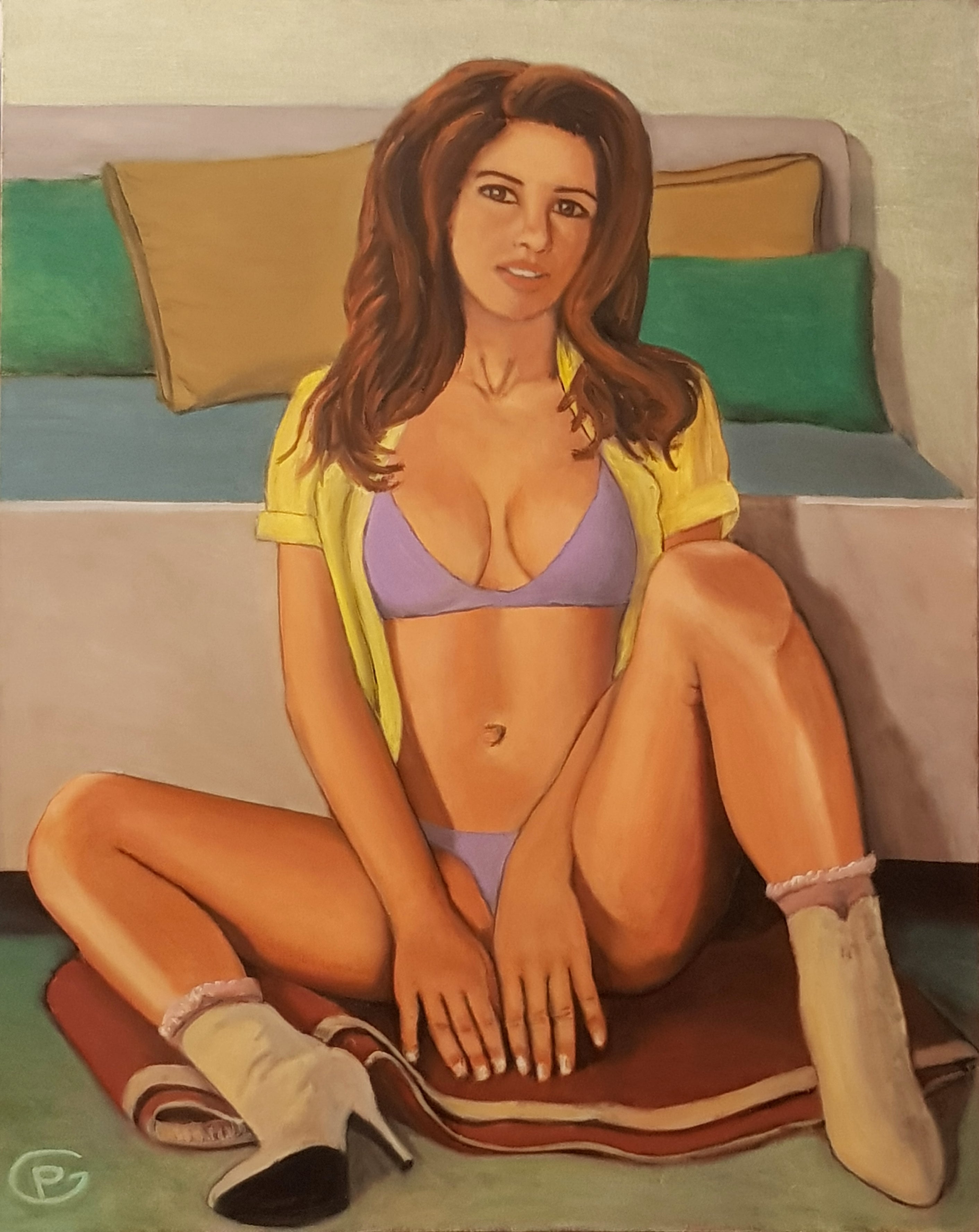 Woman sitting at the foot of the bed