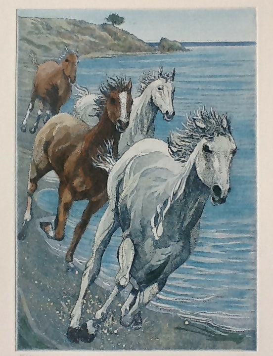 Horses running on the beach