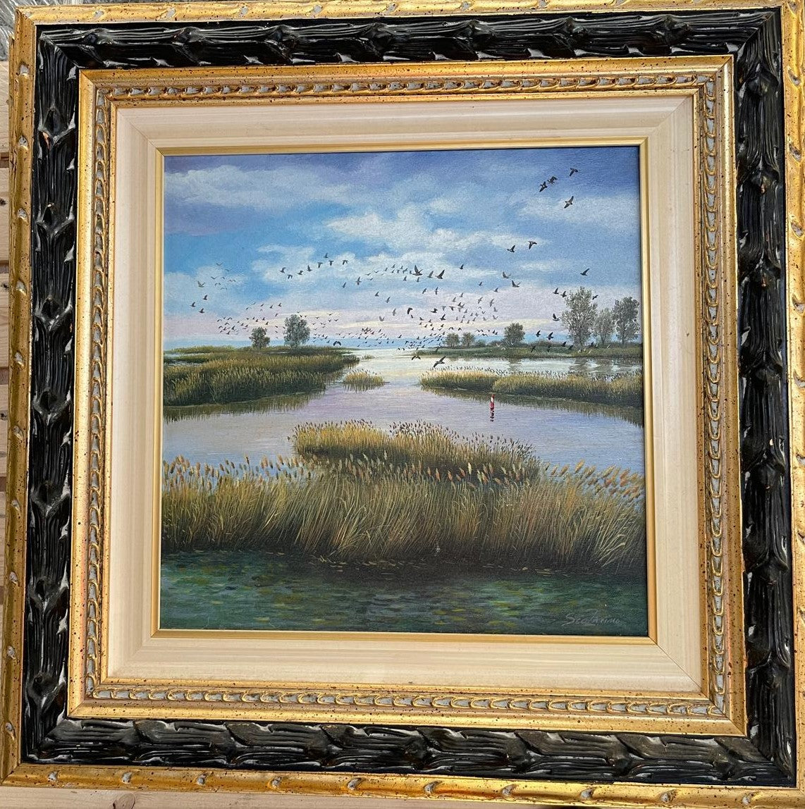 Birds flying over the lake